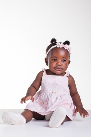 Little African girl are being photographed in the studio.の写真素材