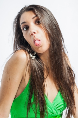 Beautiful upcoming model dressed in a playful, bright coloured, green dress.の写真素材