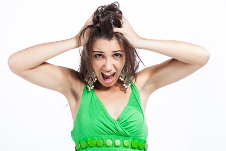 Beautiful upcoming model dressed in a playful, bright coloured, green dress.の写真素材