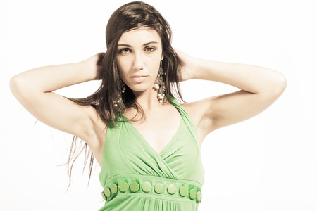 Beautiful upcoming model dressed in a playful, bright coloured, green dress.の写真素材