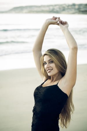 Early morning exercise and some stretches on the beach.の写真素材