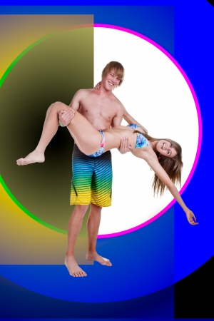 A young girl in the arms of her boyfriend lifted in the air の写真素材