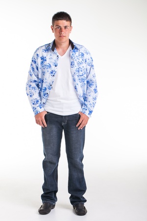 A young teenage boy being photographed in a studio.の写真素材