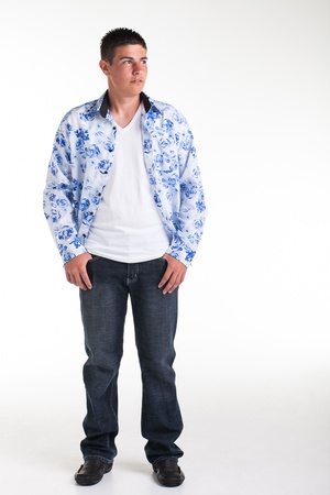 A young teenage boy being photographed in a studio.の写真素材