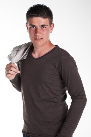 A young teenage boy being photographed in a studio.の写真素材