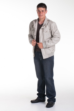 A young teenage boy being photographed in a studio.の写真素材