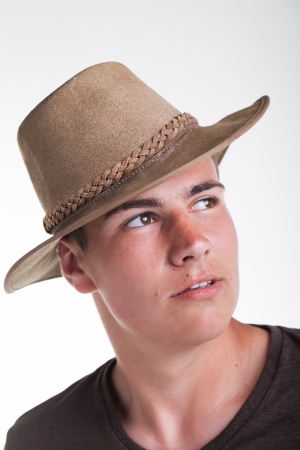 A young teenage boy being photographed in a studio.の写真素材