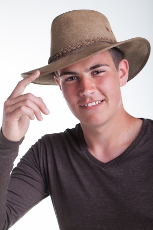 A young teenage boy being photographed in a studio.の写真素材