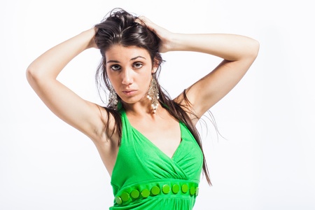 Beautiful upcoming model dressed in a playful, bright coloured, green dress.の写真素材