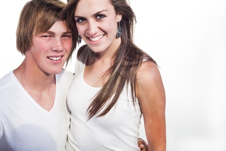 Two teenager, young and in love in the studio dressed in white の写真素材
