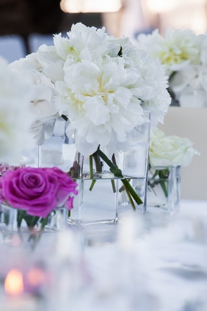 A very nicely decorated wedding table with plates and serviettes.の写真素材