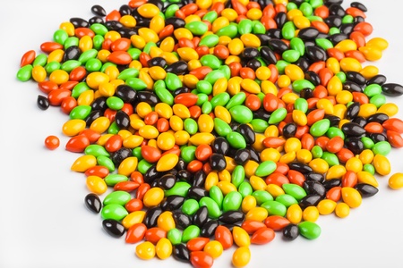 A whole lot of Colourful sweeties with green, red, yellow and black colouring.の写真素材