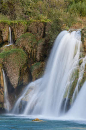 A park in  Croatia with beautiful small water falls.の写真素材