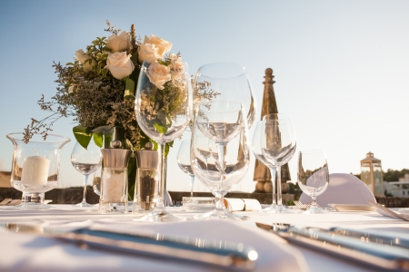 A very nicely decorated wedding table with plates and serviettes.の写真素材