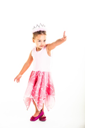 A little princess pointing fingers toward someone.の写真素材