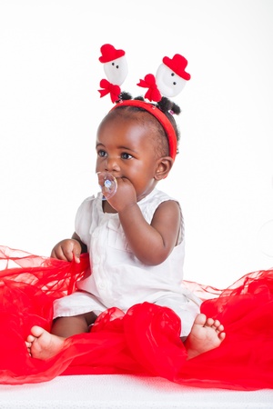 A 8 month old baby dressed to explore Christmas の写真素材
