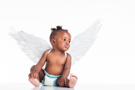 A small African baby with her angel wings on the back and a nappy on.の写真素材
