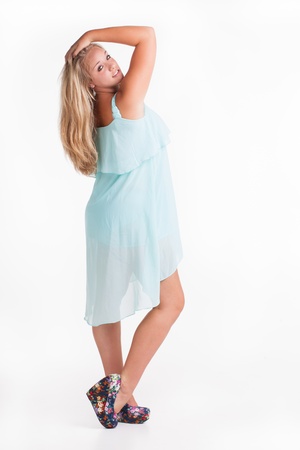 A pure teenage girl posing playful for the photographer.の写真素材