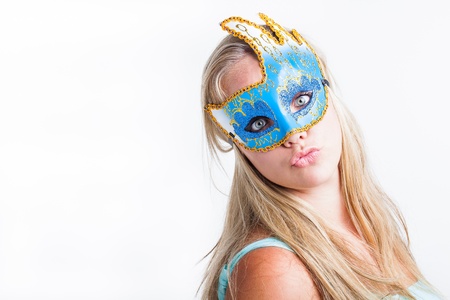 A young blond girl dressed with a blue mask.の写真素材