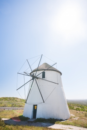 A nature photograph with the white windmill in the centre.の写真素材