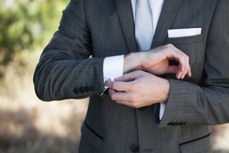 The final touches for the perfect fit of his tuxedo.の写真素材