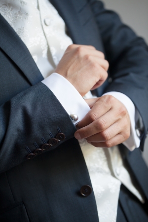 The final touches for the perfect fit of his tuxedo.の写真素材