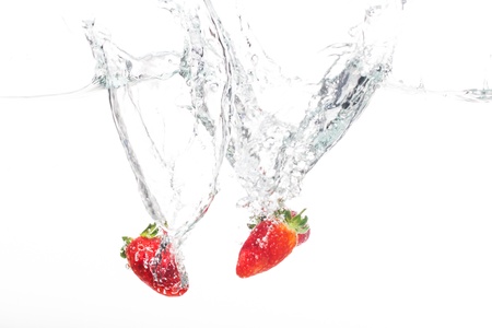 Strawberries being cleaned in fresh water.の写真素材