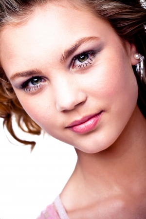 a close-up of a gorgeous young caucasion girl with shiny green eyes and soft pink lipsの写真素材