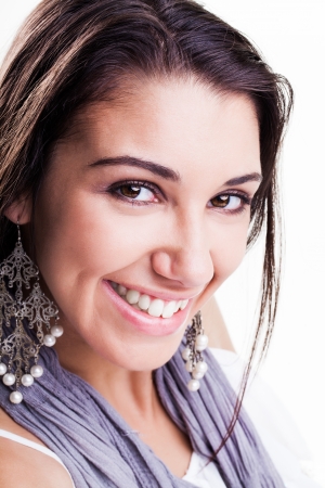 pretty caucasian girl with big brown eyes smiling brightly showing off her dimplesの写真素材