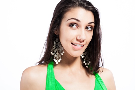 beautiful young caucasian brunette biting her lip flirtasiouslyの写真素材