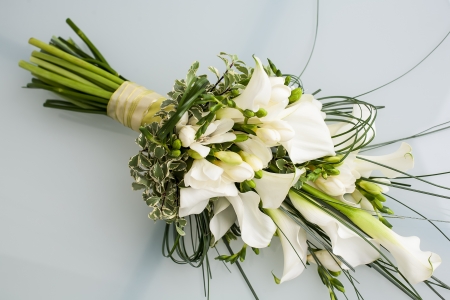 beautiful arrangement of arum lilies in a bouquetの写真素材