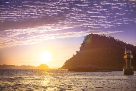 The view of the sunset on the small islandの写真素材