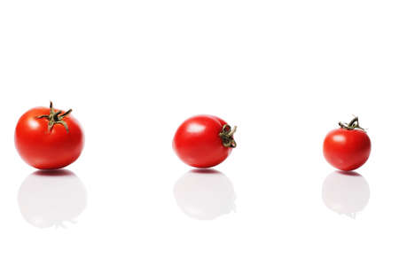 Ripe Group Of Tomatoes Isolated On White Backgroundの写真素材
