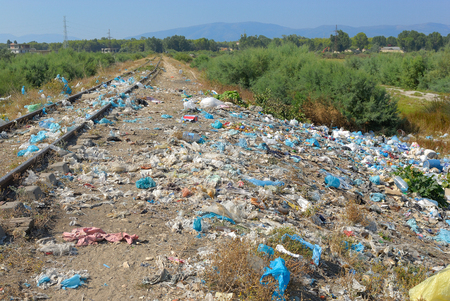 Deep sadness at seeing so much garbage in a beautiful natural place near the sea. Destroying our planet.の写真素材