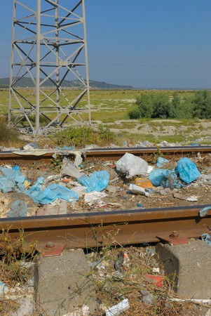 Deep sadness at seeing so much garbage in a beautiful natural place near the sea. The sea on the horizon.の写真素材