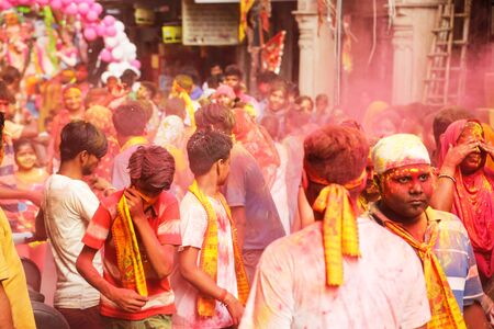 NEW DELHI, DELHI / INDIA â September 15 2016: Mixed reactions of devotees while the play with dry colors on the occasion of Ganesh Visarjan, New Delhi, India.のeditorial素材