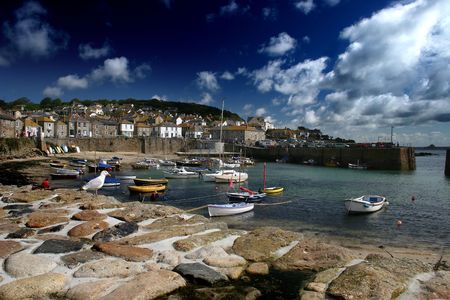The quaint fishing port of Mousehole, Cornwall, UK in summertime.の写真素材