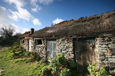 This old net and fish store stands near to the top of the slipway leading to Prussia cove, the haunt of the notorious and self styled smuggler John Carter AKA The King of Prussia.の写真素材