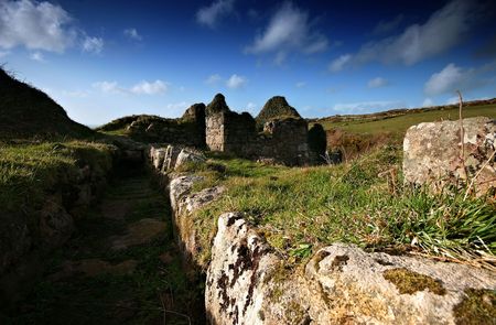 The mine remains at Porthmeor valley in West Cornwall stand testament to the tin and copper mining heritage of Cornwall, this was a small community in its own right, complete with a waterwheel and miners houses.の写真素材