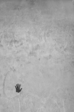 Concrete wall with a graffity of handの写真素材