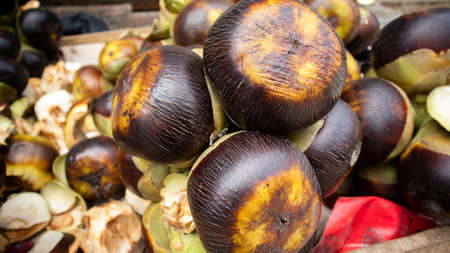 Close up shoot of ripe black  palmyra palm on van at street of Dhaka, Bangladesh