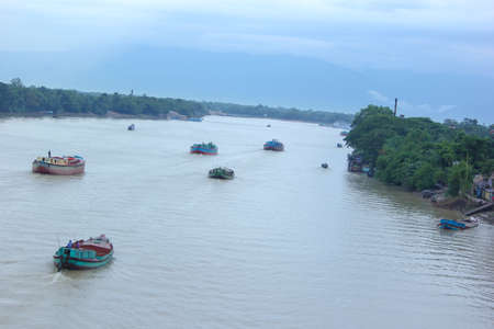 There are some sand transporter ship sailing over Tanguar Haor in Sunamganj, Bangladesh.