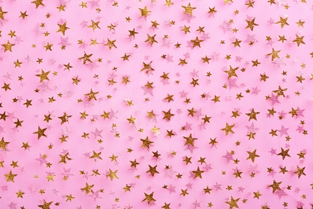 Abstract gold stars on pink textile. Backgroundの写真素材