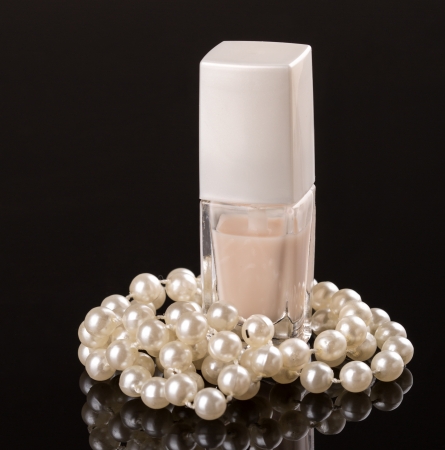 White nail polish and pearl necklaceの写真素材