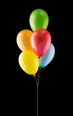 Bunch of colorful balloons isolated on blackの写真素材