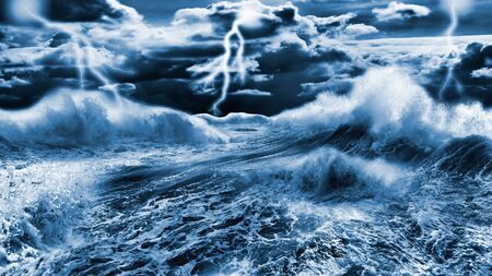 Dark stormy sea with dramatic sky and lightningsの写真素材