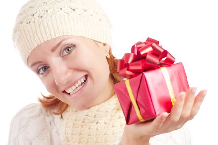 Beautiful smiling woman with gift. Isolated on whiteの写真素材
