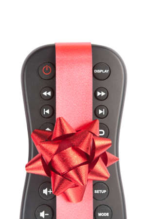 Remote  controller with red bow isolated on whiteの写真素材