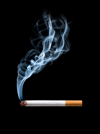 Closeup of cigarette on ashtray with wisp of smoke. Isolatedの写真素材