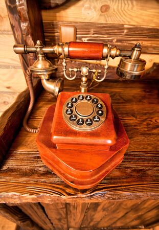 Luxury vintage interior - wooden telephone on the tableの写真素材